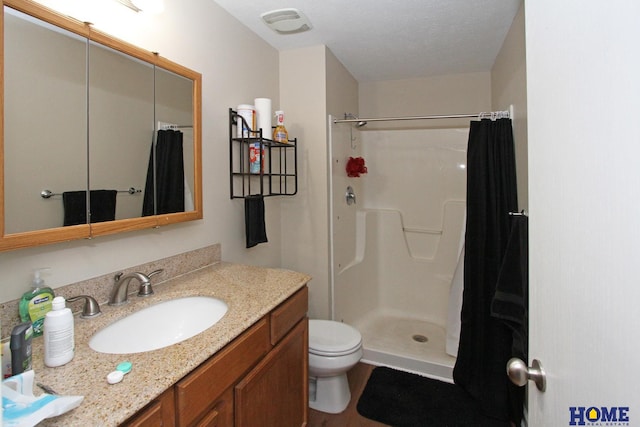 5201 N 9th Cir, Lincoln, NE 68521 - full bathroom featuring vanity, a shower with shower curtain, and toilet