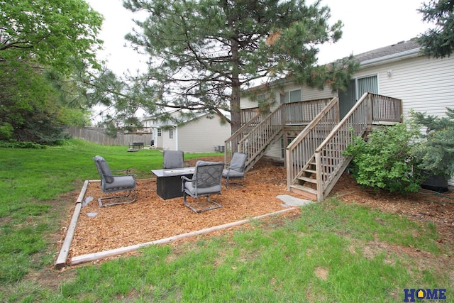 5201 N 9th Cir, Lincoln, NE 68521 - view of yard with stairway, a deck, fence, and a fire pit