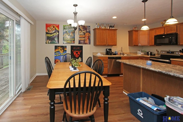 5201 N 9th Cir, Lincoln, NE 68521 - dining area featuring visible vents, light wood-type flooring, baseboards, a chandelier, and recessed lighting