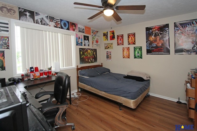 5201 N 9th Cir, Lincoln, NE 68521 - bedroom with baseboards, ceiling fan, and wood finished floors