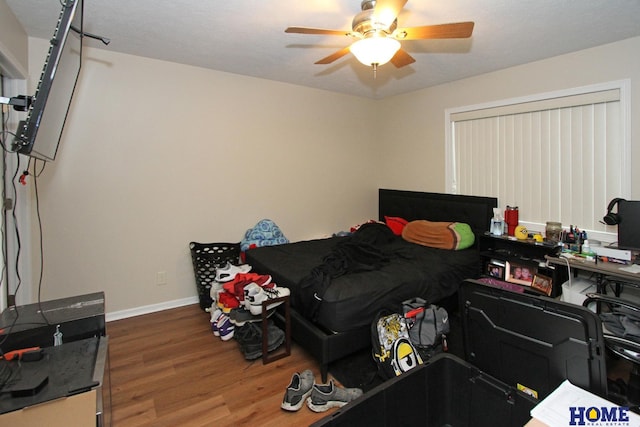 5201 N 9th Cir, Lincoln, NE 68521 - bedroom with baseboards, ceiling fan, and wood finished floors