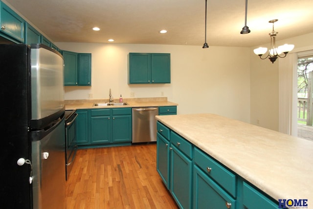 5203 N 9th Cir, Lincoln, NE 68521 - kitchen featuring appliances with stainless steel finishes, a sink, light countertops, light wood-style floors, and recessed lighting