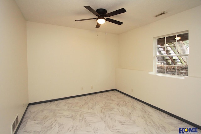 5203 N 9th Cir, Lincoln, NE 68521 - unfurnished room with ceiling fan, visible vents, and baseboards