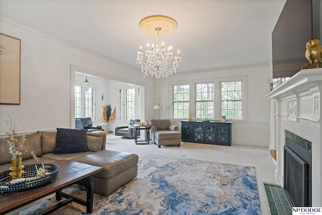 carpeted living room featuring plenty of natural light, a fireplace with flush hearth, crown molding, and a chandelier