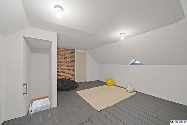 bonus room featuring vaulted ceiling and hardwood / wood-style floors