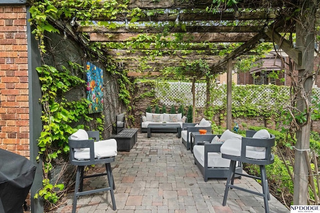 view of patio with an outdoor hangout area, a pergola, a fenced backyard, and area for grilling