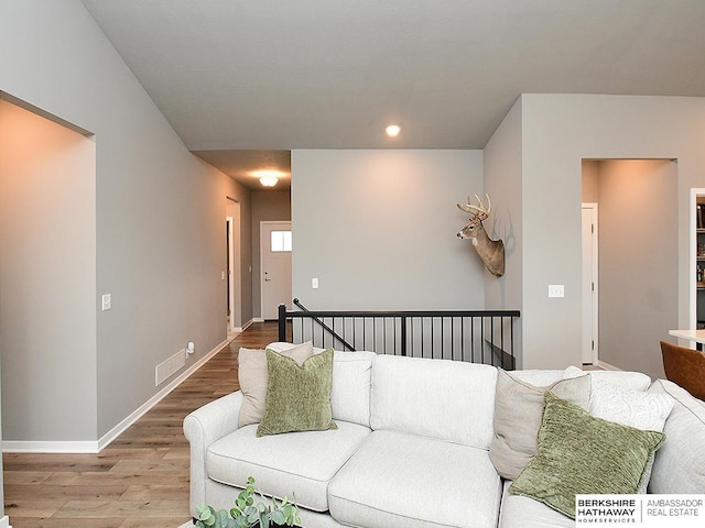 7911 N 149th St, Bennington, NE 68007 - living area featuring visible vents, wood finished floors, baseboards, and recessed lighting