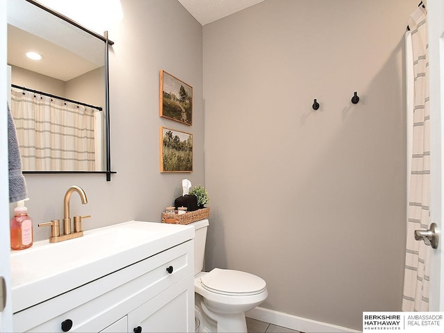 7911 N 149th St, Bennington, NE 68007 - full bath featuring toilet, baseboards, curtained shower, tile patterned flooring, and vanity