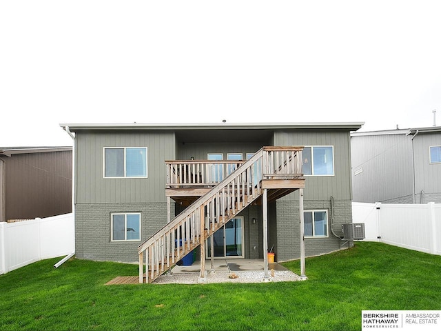 7911 N 149th St, Bennington, NE 68007 - back of property with central AC unit, stairway, brick siding, and a fenced backyard