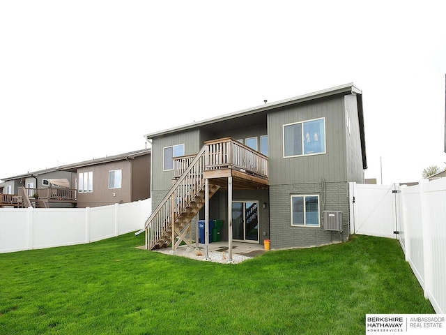 7911 N 149th St, Bennington, NE 68007 - rear view of house with a yard, stairs, a deck, a fenced backyard, and a gate