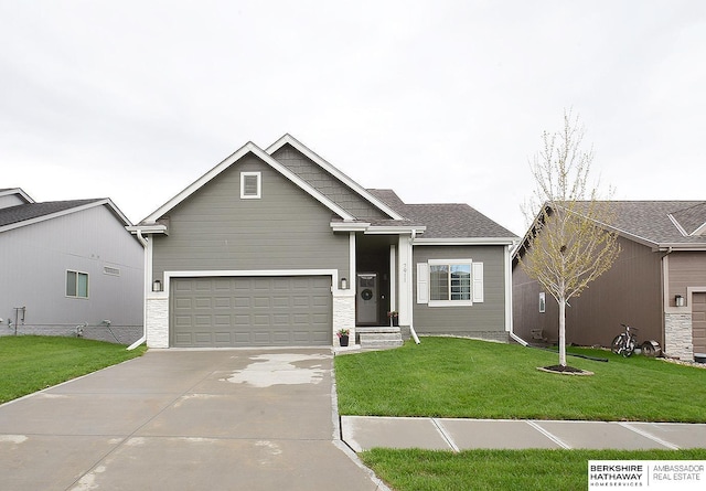7911 N 149th St, Bennington, NE 68007 - view of front of house featuring concrete driveway, a front lawn, and a garage