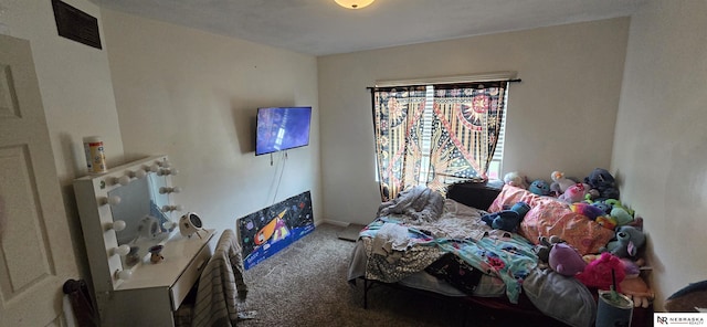 bedroom featuring carpet flooring and visible vents