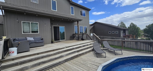 19811 L St, Omaha, NE 68135 - back of property with outdoor lounge area, a deck, fence, and roof with shingles