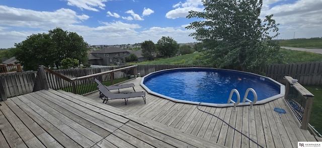 19811 L St, Omaha, NE 68135 - view of pool with a wooden deck and fence