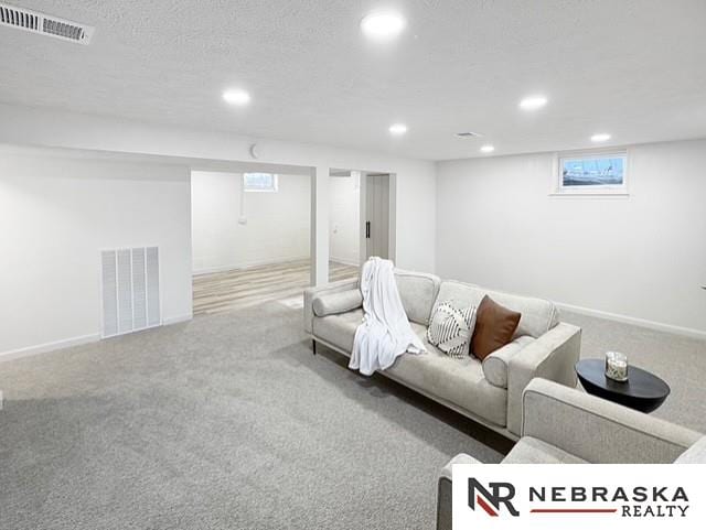 1816 S 49th St, Lincoln, NE 68506 - carpeted living area with visible vents, recessed lighting, and baseboards