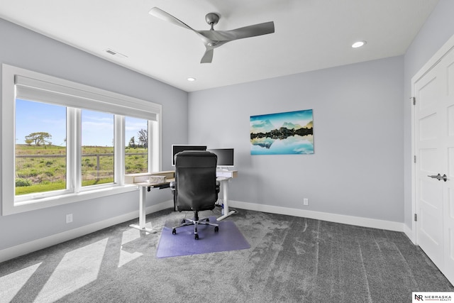 office with baseboards, a ceiling fan, carpet flooring, and visible vents