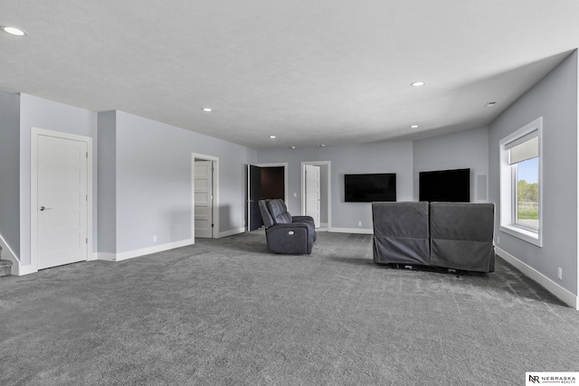 carpeted living room featuring baseboards and recessed lighting