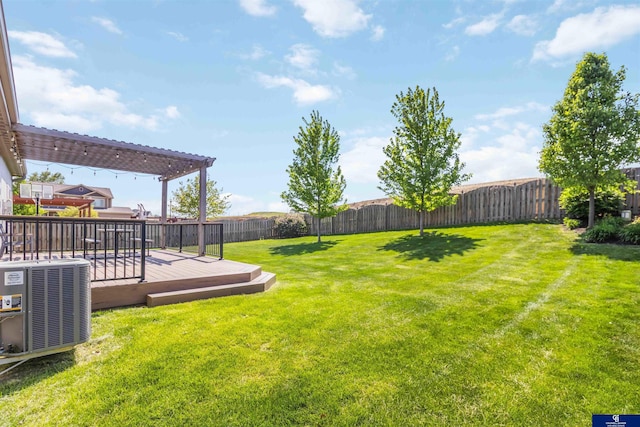 view of yard featuring central AC, a deck, and a pergola