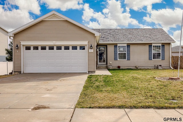 single story home with an attached garage, a front lawn, fence, and driveway