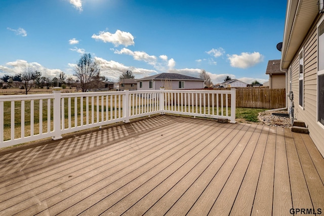 wooden terrace featuring fence