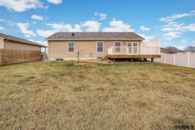 back of house with a yard, a wooden deck, and a fenced backyard