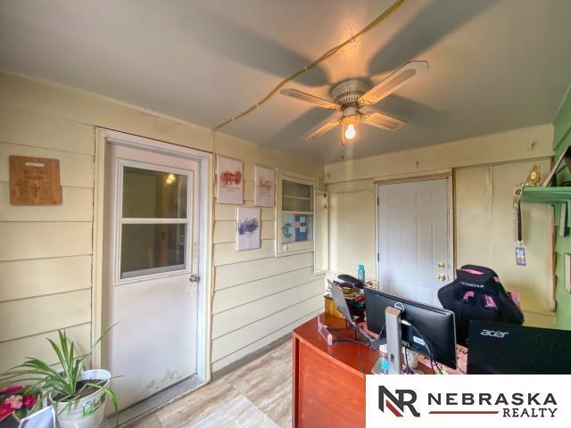 office space featuring a ceiling fan
