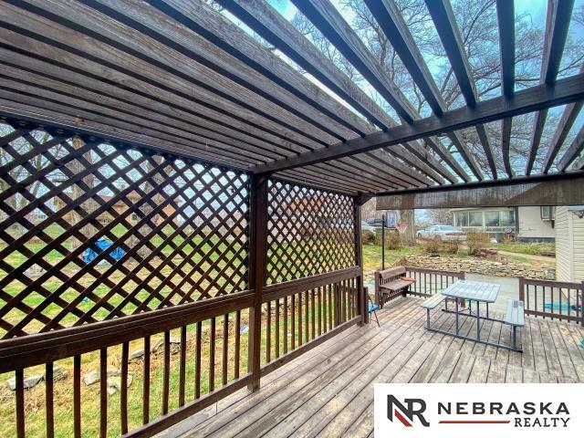 wooden deck with a pergola
