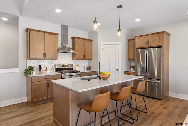 6710 S 207th Ave, Elkhorn, NE 68022 - kitchen with baseboards, wall chimney exhaust hood, a sink, appliances with stainless steel finishes, and backsplash