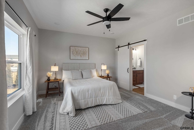 6710 S 207th Ave, Elkhorn, NE 68022 - bedroom with carpet flooring, baseboards, visible vents, and a barn door