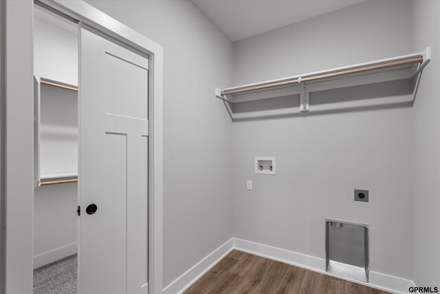 6710 S 207th Ave, Elkhorn, NE 68022 - washroom with dark wood-style flooring, laundry area, hookup for a washing machine, baseboards, and hookup for an electric dryer