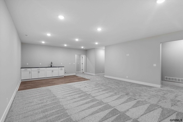 6710 S 207th Ave, Elkhorn, NE 68022 - interior space with baseboards, light carpet, recessed lighting, and visible vents