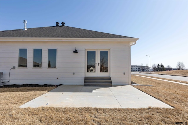 6710 S 207th Ave, Elkhorn, NE 68022 - back of house featuring french doors, entry steps, a patio area, and roof with shingles