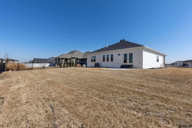 6710 S 207th Ave, Elkhorn, NE 68022 - back of property with french doors, fence, central AC unit, and a lawn