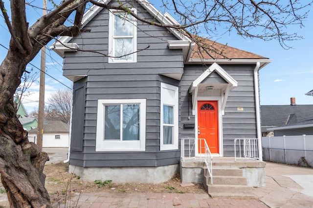 view of front of home with fence