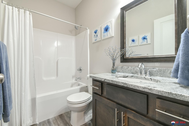 full bath featuring vanity, toilet, wood finished floors, and shower / bath combination with curtain