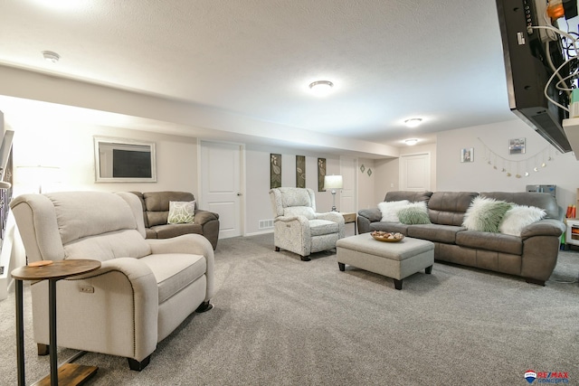 living area featuring carpet