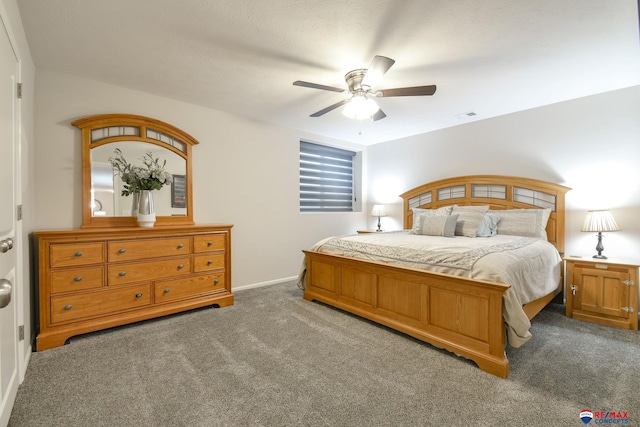 carpeted bedroom with a ceiling fan, baseboards, and visible vents