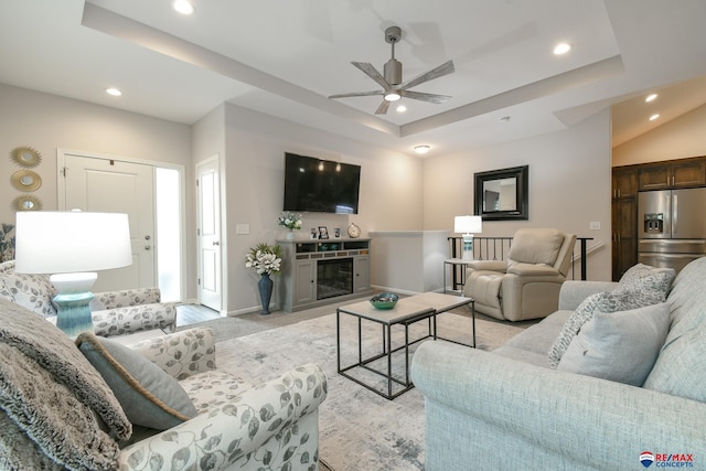 living room featuring baseboards, a ceiling fan, recessed lighting, and light colored carpet