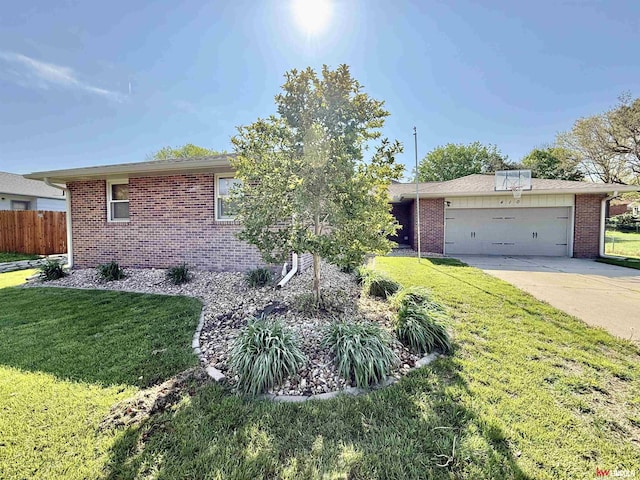 ranch-style home with fence, a garage, a front lawn, and brick siding