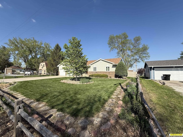 exterior space with fence and concrete driveway