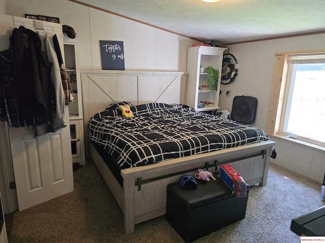 bedroom featuring crown molding, carpet flooring, vaulted ceiling, and multiple windows