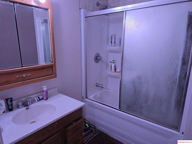 full bath featuring bath / shower combo with glass door and vanity