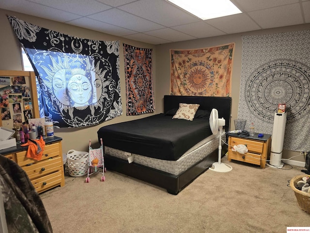 bedroom featuring carpet floors and a paneled ceiling