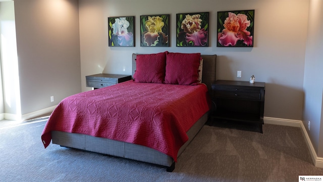 carpeted bedroom featuring baseboards