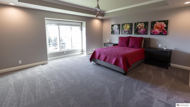 bedroom with crown molding, baseboards, carpet, a tray ceiling, and recessed lighting