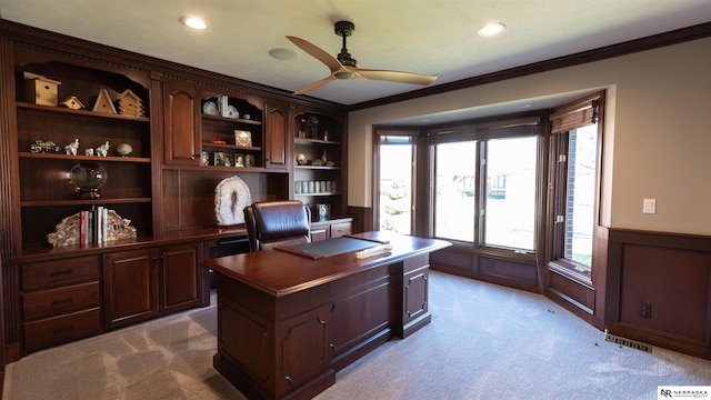office space featuring ceiling fan, carpet flooring, a wainscoted wall, ornamental molding, and recessed lighting