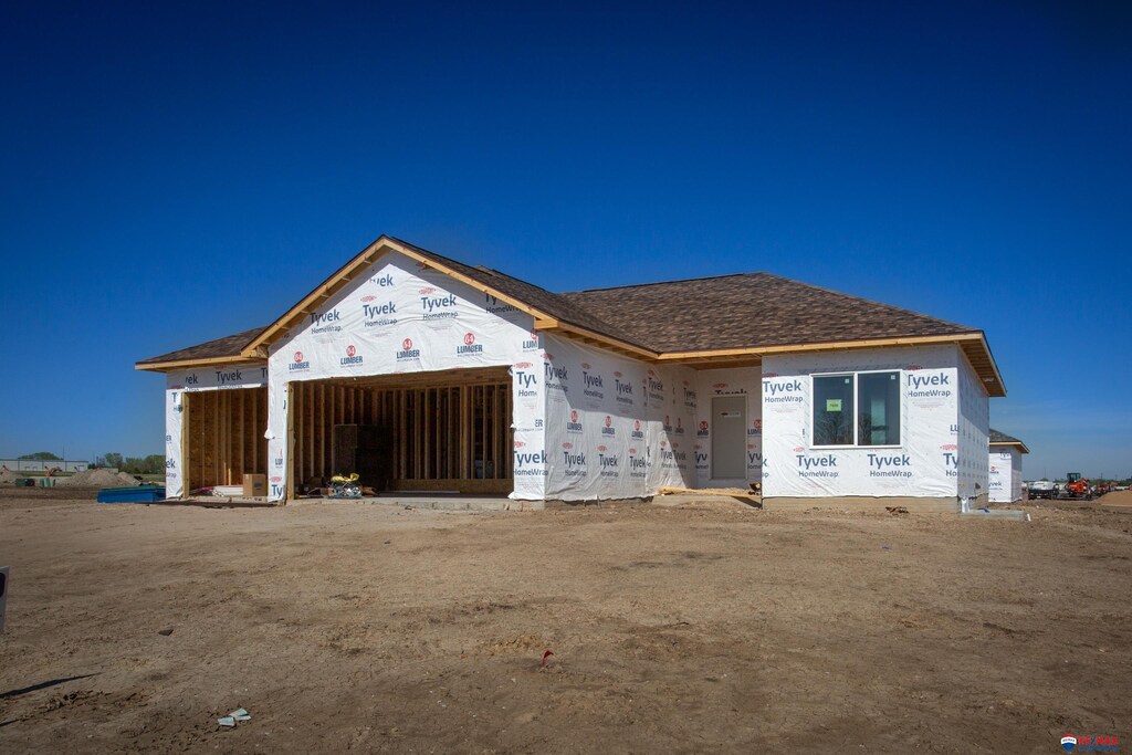 property in mid-construction featuring a garage