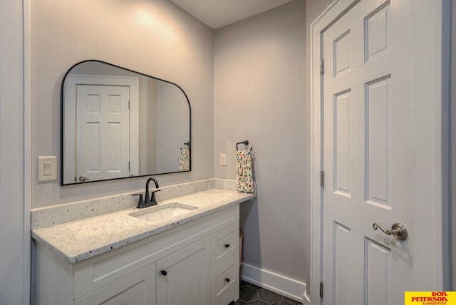1638 N Nye Ave, Fremont, NE 68025 - bathroom with vanity, baseboards, and tile patterned floors