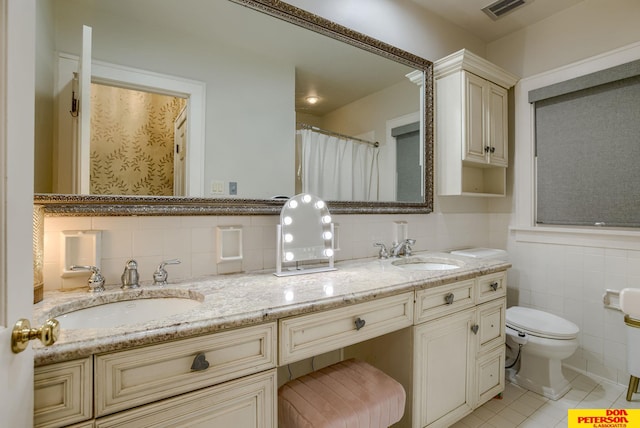 1638 N Nye Ave, Fremont, NE 68025 - full bathroom with a sink, tile patterned flooring, tile walls, and visible vents