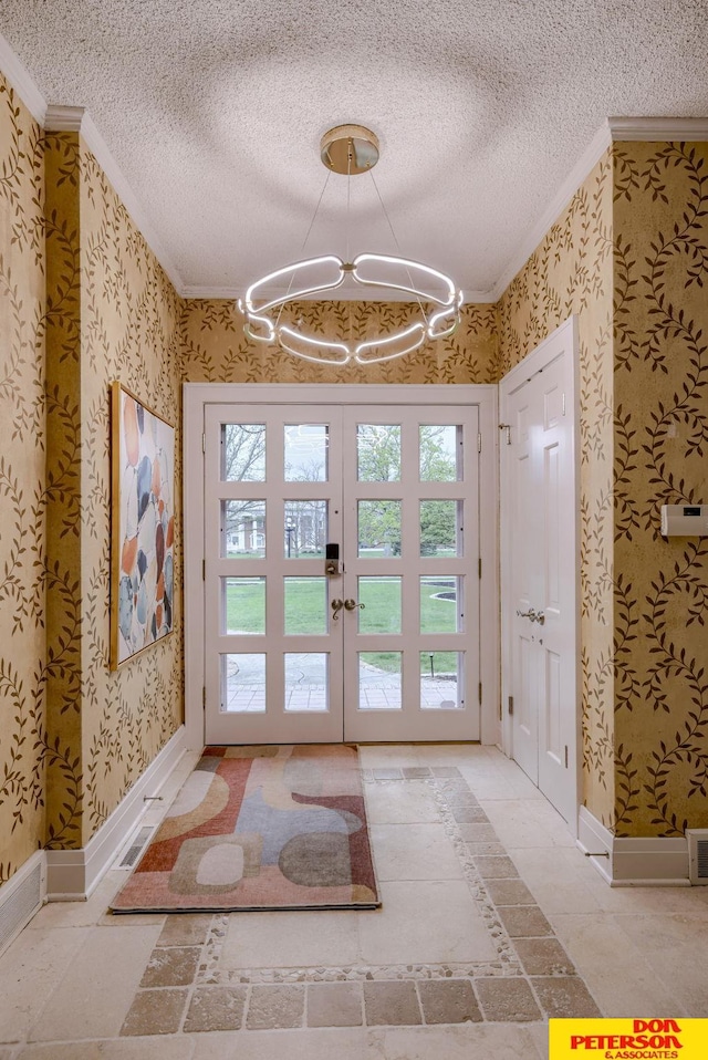 1638 N Nye Ave, Fremont, NE 68025 - entryway featuring an inviting chandelier, ornamental molding, and wallpapered walls